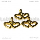 Charm Cuori intrecciati in metallo gold plated 21x7mm