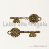 Ciondolo double-face chiave in metallo color bronzo 34x11mm