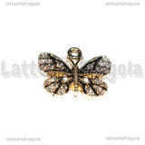 Ciondolo Farfalla in metallo dorato smaltato con strass 19x17mm