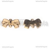 Connettore Fiocco in metallo gold plated smaltato rosa 15x9mm