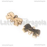 Connettore Fiocco in metallo gold plated smaltato rosa 15x9mm