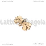 Connettore Fiocco in metallo gold plated smaltato rosa 15x9mm